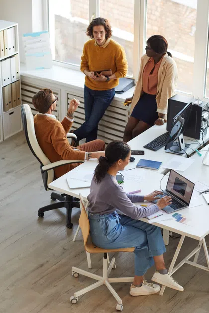 A diverse group of professionals collaborating in a modern office space.